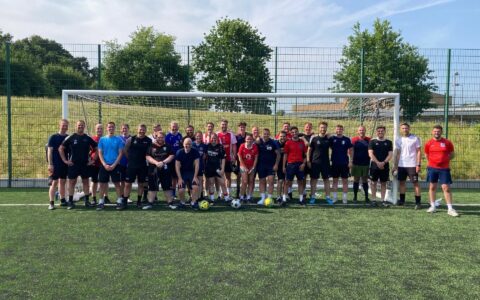 A team photo of male and female football players from the Retford Oaks staff team